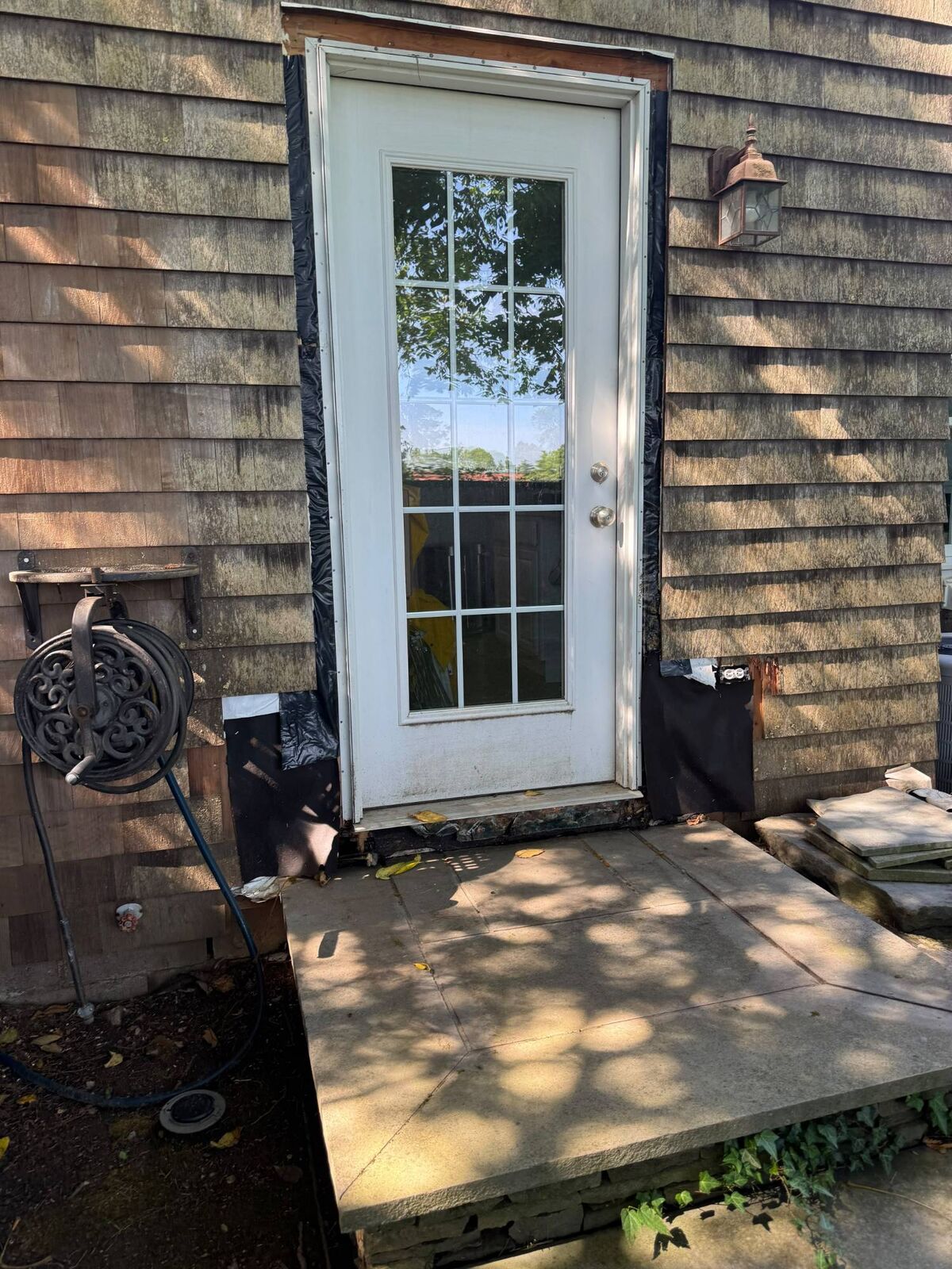 Exterior door installation in progress before siding and trim